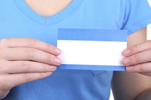 woman holding blank name label