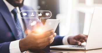 man on phone checking social media