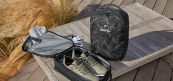 open bag with shoes beside a closed bag